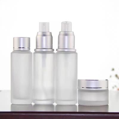 China Luxury Personal Care Cosmetics Packaging Glass Bottle Sets Empty Glass Cream Jar And Pump Spray Bottle Set Skin Care Face Cream Lotion Bottle for sale