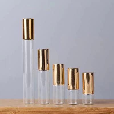 China Personal Care 10ml 15ml Glass Bottle For Essential Oil Rollball Bamboo Bottles For Perfume Essential Oil Glass Bottle With Gold Cap for sale