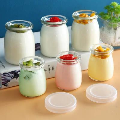 China 100ml 150ml 200ml Candy Pudding Jam Stocked Glass Jar With Cork Lid Plastic Lid for sale