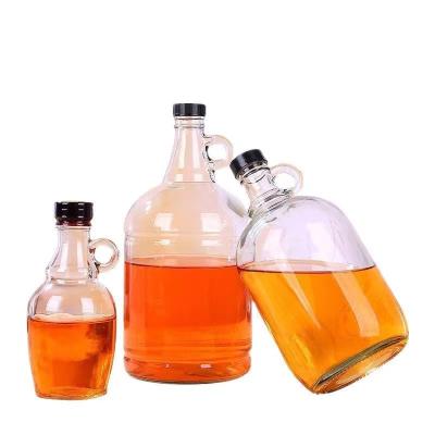 China Empty 500ml 1000ml 2000ml Glass Liquor Syrup Bottles With Metal Lids Glass Maple Syrup Bottles California Red Wine Bottle for sale