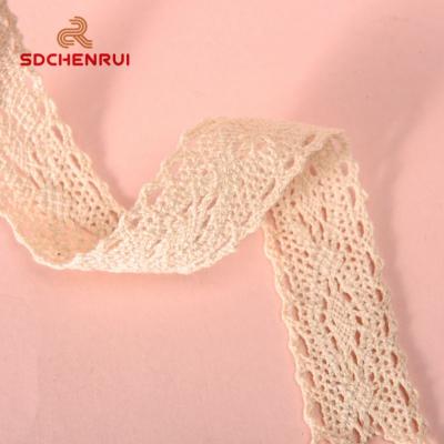 China High Tenacity 1inch Width Cream White Hollow Lace Cotton Ribbon For Apparel Accessories for sale