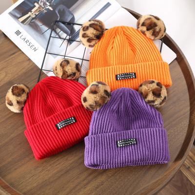 China New COMMON 2021 Hot Selling 10 Colors Running New Coming Wholesale Ball Caps Hats For Women With Double Leopard Fur Ball Knit Hat for sale