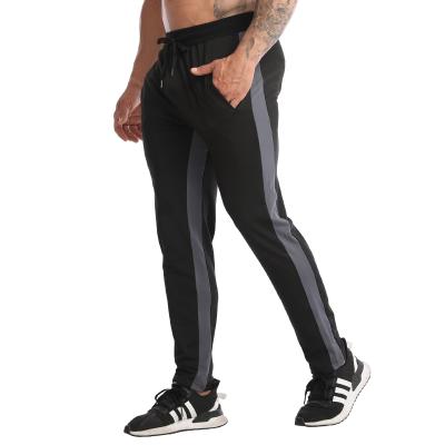 China Solid Loose Casual Elastic Waist Pants Men's Long Pants Anti-Wrinkle Scratch Quick-Dry Running Gym Pants For Men for sale