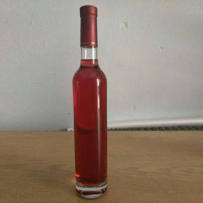 China Customizable Logo Printing Slim Tall Round Glass Vodka Liquor Bottles with Cork Seal for sale