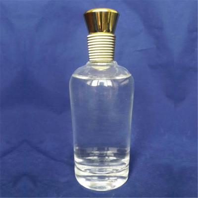 China Free Sample 500 ml 750 ml Glass Round Liquor Bottle with Cork Sealing Type for sale