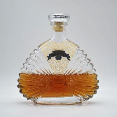 China Super Flint Glass Whiskey Rum Gin Bottles with Custom Relief Carving Design and Wooden Stopper for sale