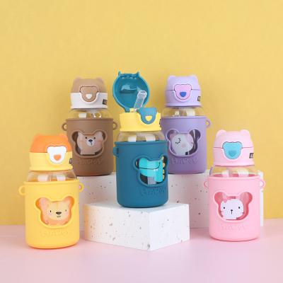 China Wholesale Viable Cartoon Children's 600ml Water Bottles Plastic Sippy Cup With Silicone Sleeve for sale