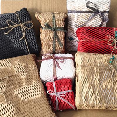 China Recycled Materials 30cm 50cm Honeycomb Kraft Paper Core Decorations Honeycomb Wrap Honeycomb Cushion Wrapping Paper Roll Recycled Shockproof Red Paper Roll for sale