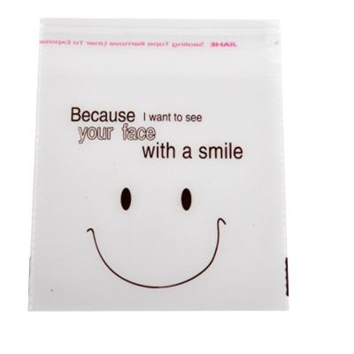 China Recyclable Clear Cellophane Bag With Self Adhesive Smiley Face For DIY Plastic Candy Cookie Baking Bag for sale