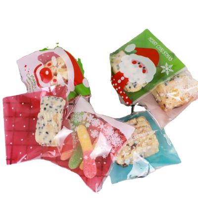 China Safety 100pcs/bag 2022 New Year Christmas Candy Packaging Santa Gift Bag Xmas Plastic Bag Christmas for sale