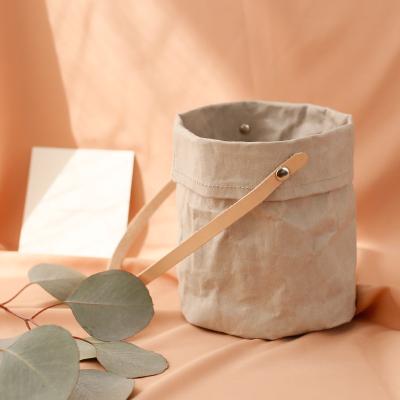 China Modern Reusable Kraft Paper Flower Pot Cover Sundries Storage Bucket With Leather Handle for sale