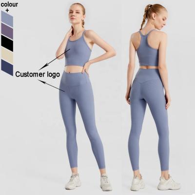 China Antibacterial Women Sports Wear 2PCS Ribbed Yoga Sets Fitness With Hidden Belt Pocket for sale