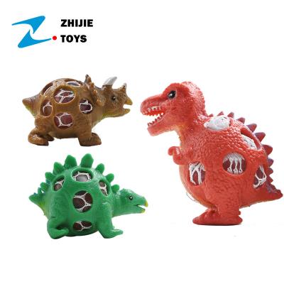 China Hot Selling TPR Squishy Squeeze Toy Squeeze TPR Funny Dinosaur With Squishy Mesh Balls for sale