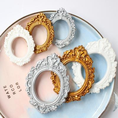 China Fashion world style craft photo electroplating photo frame resin flatback design baby oval cabochons diy props for sale