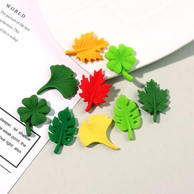 China Global yiwu insheen art spirit craft supplier cheap price new design ginkgo maple leaf resin flat back cabochons for sale