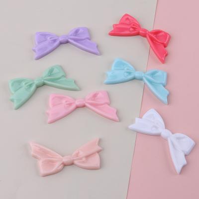 China Global cute colorful flatback bow knot design resin cabochons children hair band hair clip hair ornament decoration for sale