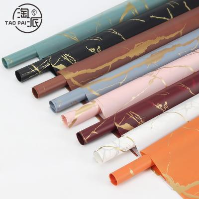 China 2021 Raincoats New Design Matte Waterproof Ready Popular For Shipping Flower Wrapping Paper for sale