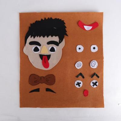 China Children's Learing Toys Kindergarten DIY Face Expression Stickers Toys Early Materials Education Felt Manual Felt Toys for sale