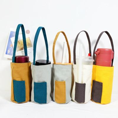 China Viable Minimalist Simple Canvas Bottle Holder Water Bottle Carrier Tumbler Tea Carrier Cloth Cup Holder for sale