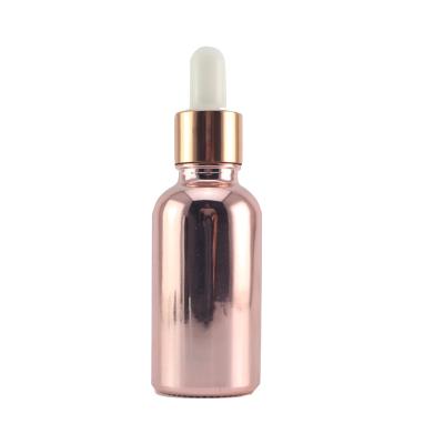 China Cosmetic Cosmetic Packaging Plating Mounted Gold Dropper Glass Bottle For Essential Oils for sale