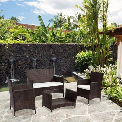 China Minimalist Classic Style 4 Pcs Rattan Sofa Set Outdoor Garden Patio Furniture With Black Glass Coffee Table for sale