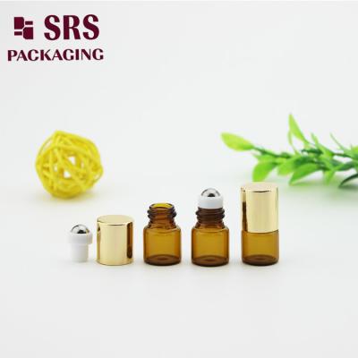 China SRS empty 1ml amber glass roller ball bottle with gold aluminum cap for sale