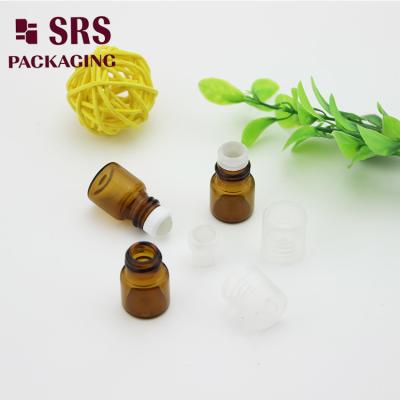 China SRS empty 1ml amber glass roll on perfume bottle with clear plastic cap for sale