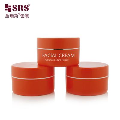 China SRSJK-100g Empty manufacture solid orange color plastic jar set with gold collar line white logo printing for balm Creams and Moisturizers for sale