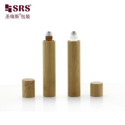 China Portable 10ML Empty Bamboo Roll On With Bamboo Cap Amber Bottle Clear Bottle Window Skylight Design In Stock for sale