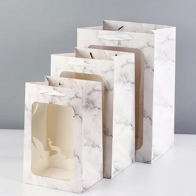 China Fashionable White Color Jewelry Recyclable Luxury Paper Bag Shopping Foldable Paper Bag With Big Ribbon for sale