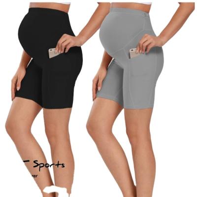 China Breathable Soft High Waist Pregnancy Sportswear Workout Training Yoga Shorts Pocket Design Maternity Shorts for sale