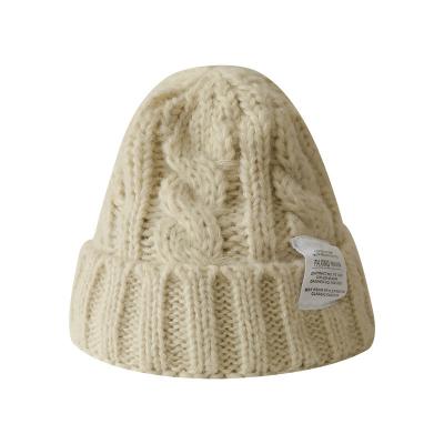 China New COMMON Pompom Winter Hat Thick Warm Twisted Woolen Fashion Knit Pom Wholesale Solid Plain Designer Beanie Hats for sale