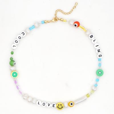 China Martha's funny smile soft pottery face pearl LOVE natural freshwater calvo beach style letter jewelry happy go away lucky necklace for sale