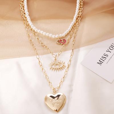 China FASHIONABLE Gold Plated Heartsick Eyes Dangling Bead Chain Choker Copper Layered Beaded Necklace For Women for sale