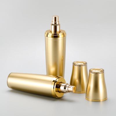 China 100ml Cosmetic Gold Acrylic Plastic Essence Bottle Cosmetic Liquid Packaging Bottle With Pump Head for sale