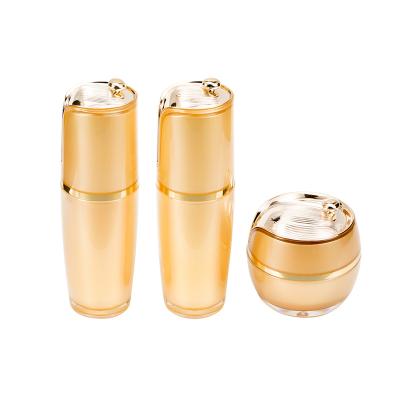 China Luxury Orange Cosmetic Lotion Cream Cosmetic Set Skin Care Jar Packaging Container With Pump Head for sale