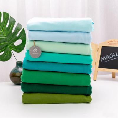 China Anti Pill In Solid Green Color 95%cotton 5%lycra Stock Knitted Fabric For Christmas for sale