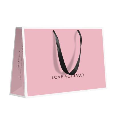 China Wholesale Handmade Apparel Clothing Shoes Paper Bag Pink Logo Printing Retail Black Bag Custom Made For Garment Jewelry Makeup Watch Packaging for sale