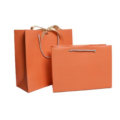 China Handmade Custom Logo Paper Bag for Clothes/High Quality Durable Shopping Bag for Shoes/Cosmetic Bags with Ribbon and Bow for Jewelry Package for sale