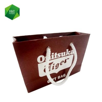 China Disposable Custom Design Wallet Red Ribbon Shopping Handle Printing Packaging Paper Bags for sale