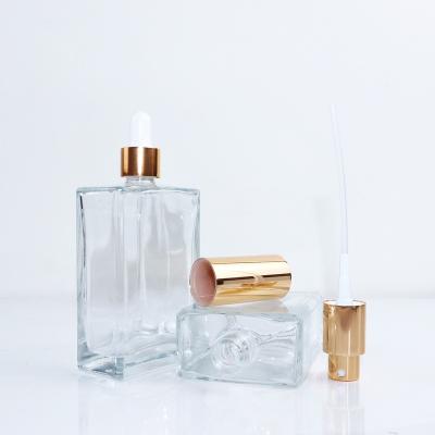 China Custom Transparent Empty Square Glass Cosmetic Skin Care Essence Glass Bottle 30ml 50ml 75ml 100ml Dropper Bottle for sale