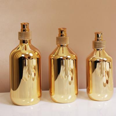 China 300ml 400ml 500ml Gold Plated Cosmetic Bottle Plastic Cosmetics Bottle for sale