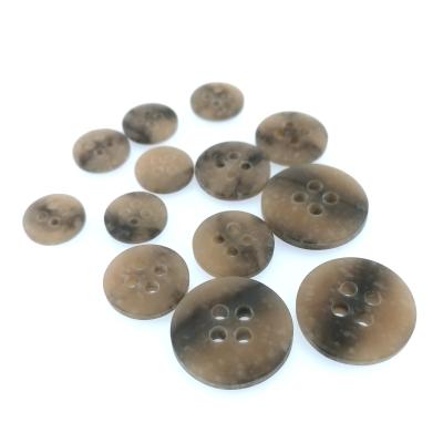 China Volume Sustainable Product Excellent Quality Resin Four Eyes Buttons For Overcoat for sale