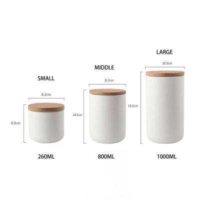 China Freshness Preservation 3 Sizes Pure White And Black Storage Jar Sets Jug With Wood Lid for sale