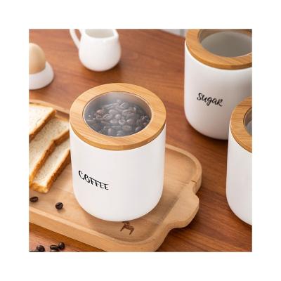 China Freshness Preservation Ceramic Kitchen Canisters for Countertop With Airtight Wooden Transparent Lids Baby Food Storage Jar for sale