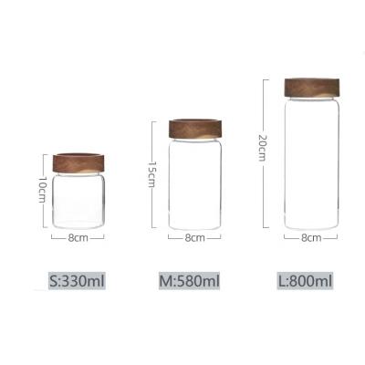 China Freshness Preservation Hand-Blown Borosilicate Glass Canister With Acacia Wood Lid For Sugar Tea Coffee Beans Candy Spice Jar Glass Jar With Lid for sale