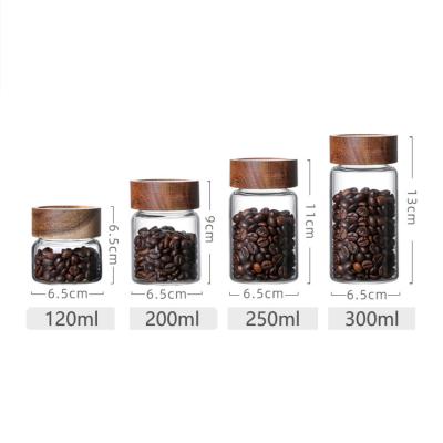 China Freshness Keeping Tea Coffee Bean Container Jar Kitchen Glass Storage Jar with Wooden Lid for Food Storage Spice Yogurt Glass Jar Small for sale