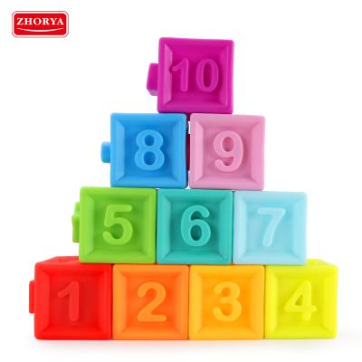 China Use new hot sell color material silicone rubber brick 3d baby construction bold character soft educational toy plug rubber toy for sale