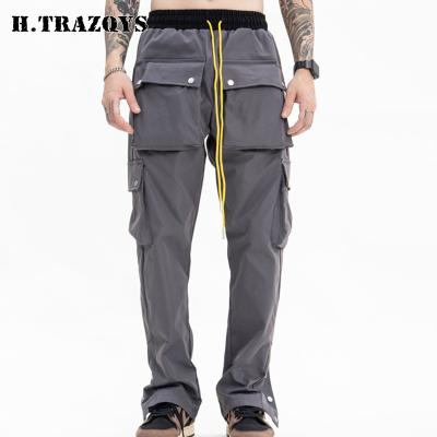 China New Design Anti-wrinkle High Street Custom Wear Mens Multi Pockets Blanket Cargo Pants With Button Bottom for sale