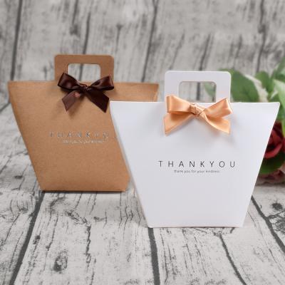 China High End Recyclable IMEE Kraft Paper Simple Color Printed Mini Paper Gift Package Bag Candy Box With Handles for sale